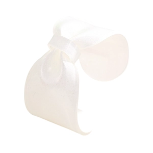 Close-up of translucent white resin bow cuff bracelet with sparkling glitter finish