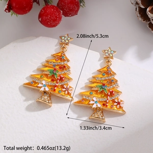 Detail view of festive Christmas tree drop earrings with stars and colorful rhinestones