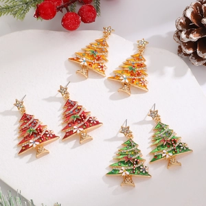 Close-up of rhinestone Christmas tree earrings with colorful crystals and holiday motifs
