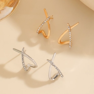 Cross X-shaped hoop earrings in gold and silver finish with sparkling zircon accents