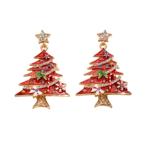 Close-up of Christmas tree earrings with red enamel and sparkling crystal stones