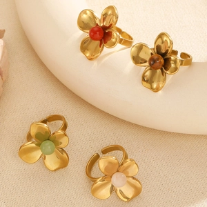 Set of four flower shaped stainless steel open rings with colorful natural stones