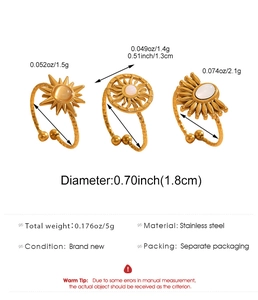 Detailed view of three 18k gold plated stainless steel sun motif rings with opals