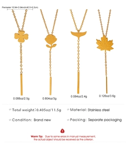 Detail of four stainless steel Y-necklaces with clover rose whale tail and maple leaf