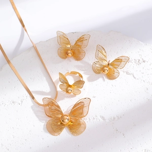 Detailed view of the hollow flower necklace with matching ring and stud earrings set