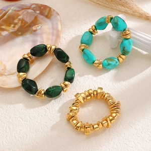 Detail of bohemian resin and alloy beaded bracelet set with turquoise marble patterns