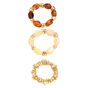 Close-up of retro beaded bracelet set with amber resin and gold ribbed metal beads