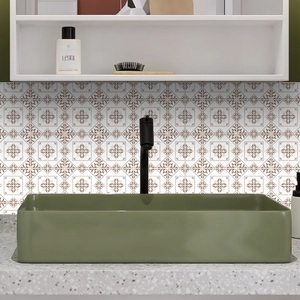 Close-up of olive green ceramic vessel sink with modern rectangular design on tiled wall