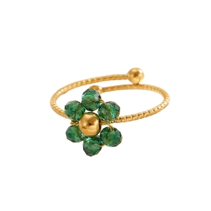 Verstellbarer Edelstahlring in Gold mit grüner Kristallblume und Spiralstruktur