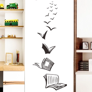 Creative black silhouette wall decal featuring books transforming into flying birds