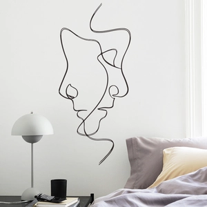 Minimalist black line art wall sticker featuring intertwined human silhouettes for bedroom decor