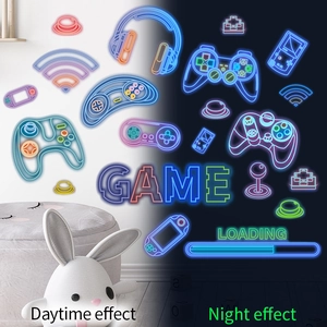 Fluorescent game controller wall decals showing blue glow effect in dark and daytime look