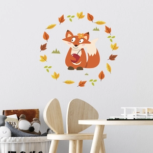 Detailed close-up of cartoon fox and autumn leaves wall stickers in a cozy kid's room