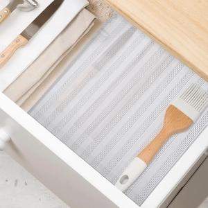 Translucent white EVA shelf liner with non-slip circular texture for kitchen cabinets