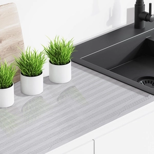Close-up of waterproof silver kitchen cabinet liner with non-slip wavy texture