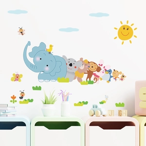 Close-up of pastel cartoon animal wall stickers featuring an elephant and koala for nursery décor