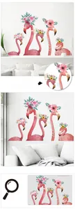 Detail of pink flamingo wall decals with floral accents and inspirational English quotes