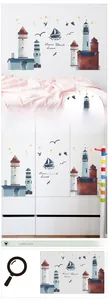 Detail of lighthouse and sailboat wall stickers on bedroom walls and closets