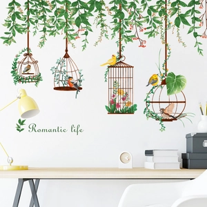 Pastoral wall decal featuring bird cages and green vines for living room decor