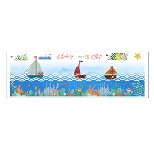 Detail of adhesive wall sticker with sailboats, sea waves and colorful marine creatures
