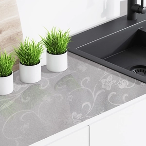Self-adhesive kitchen backsplash sticker with gray floral pattern and textured finish