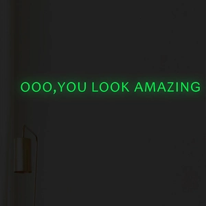 Green glowing neon sign displaying You Look Amazing text for wall decor
