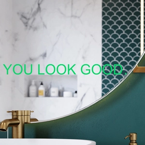 Luminous You Look Good wall sticker on bathroom mirror with marble tile background