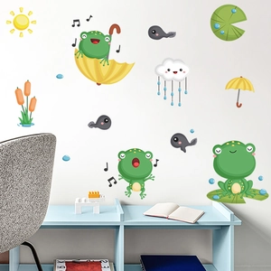 Detailed view of cartoon frog and tadpole wall stickers in a bright children room