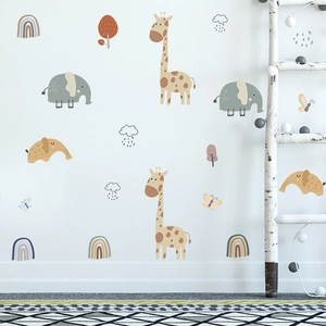 Detail of cartoon giraffe and elephant wall stickers in soft Morandi colors for kids