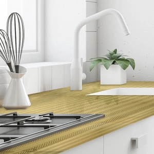 Close-up of golden self-adhesive kitchen wall sticker with cross-woven mesh texture