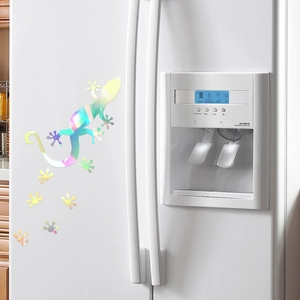 Holographic lizard and paw print decal set with rainbow reflective finish on white fridge