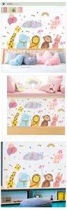 Detail showing cartoon animal wall stickers with giraffe and lion in a nursery room decor