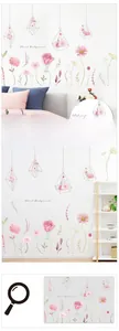 Close-up of floral wall decals featuring watercolor pink roses and daisies for home decor