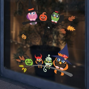 Halloween window decals featuring cartoon owls and Happy Halloween text for party decor
