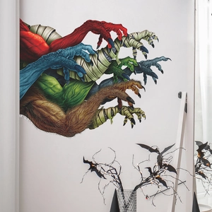 Spooky Halloween wall decals featuring diverse monster claws and zombie hands for party decor