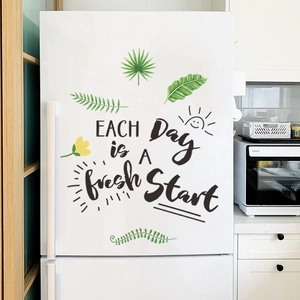 Self-adhesive green leaf wall decals with English quote on a white refrigerator surface
