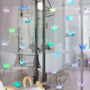 Iridescent laser PET crown stickers displayed on a transparent glass door surface