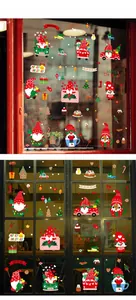 Detailed view of Christmas gnome static stickers and holiday decor on glass windows