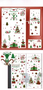 Macro view of Christmas window stickers with gold reindeer and glitter snowflake details