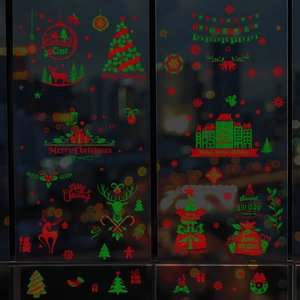 Christmas window decals with gold reindeer and glitter snowflakes for festive glass decoration