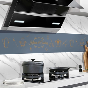 Blue kitchen wall sticker with orange utensils and Kitchen & Cooking text over a stove