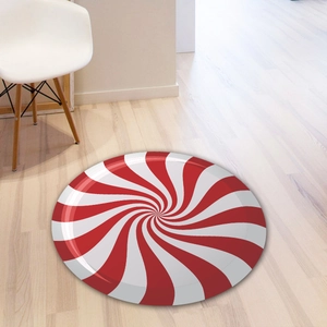 Pfefferminz-Bonbon-Spiralaufkleber auf hellem Holzboden für Weihnachtsdekoration