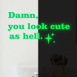 Glow in the dark wall sticker featuring stars and Damn you look cute as hell text