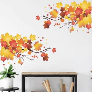 Detail of autumn maple leaf wall stickers with warm orange branches for home decoration