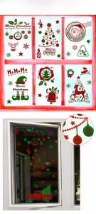 Detail of glitter gold and green static Christmas window stickers with Santa and reindeer