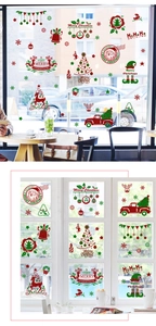 Detailed Christmas window stickers featuring Santa Claus and reindeer on glass surfaces