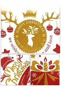 Detailed macro view of red and gold glitter Christmas window stickers with festive motifs
