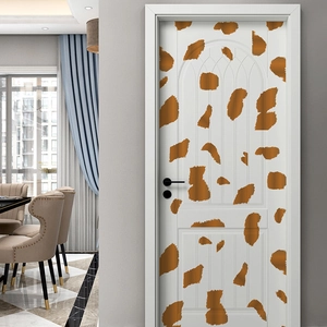 Detail view of artistic giraffe texture door sticker on a modern white interior wood door