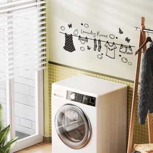 Detail view of Laundry Room wall decal with clothes, birds, and art lettering