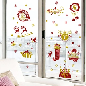 Golden Christmas window stickers featuring red reindeer and snowflakes for festive decor